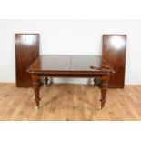 A Victorian mahogany extending dining table