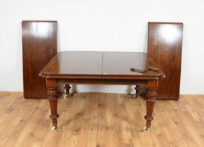 A Victorian mahogany extending dining table