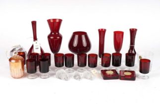 A collection of cranberry glass and other crystal glass ware