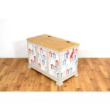 A modern painted oak children's toy chest