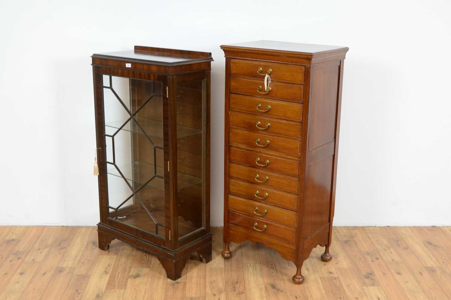 A 20th Century mahogany music cabinet with a glazed bookcase