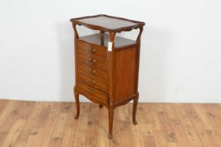 An attractive early 20th Century mahogany and cross-banded serpentine music cabinet