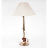 A brass table lamp and shade