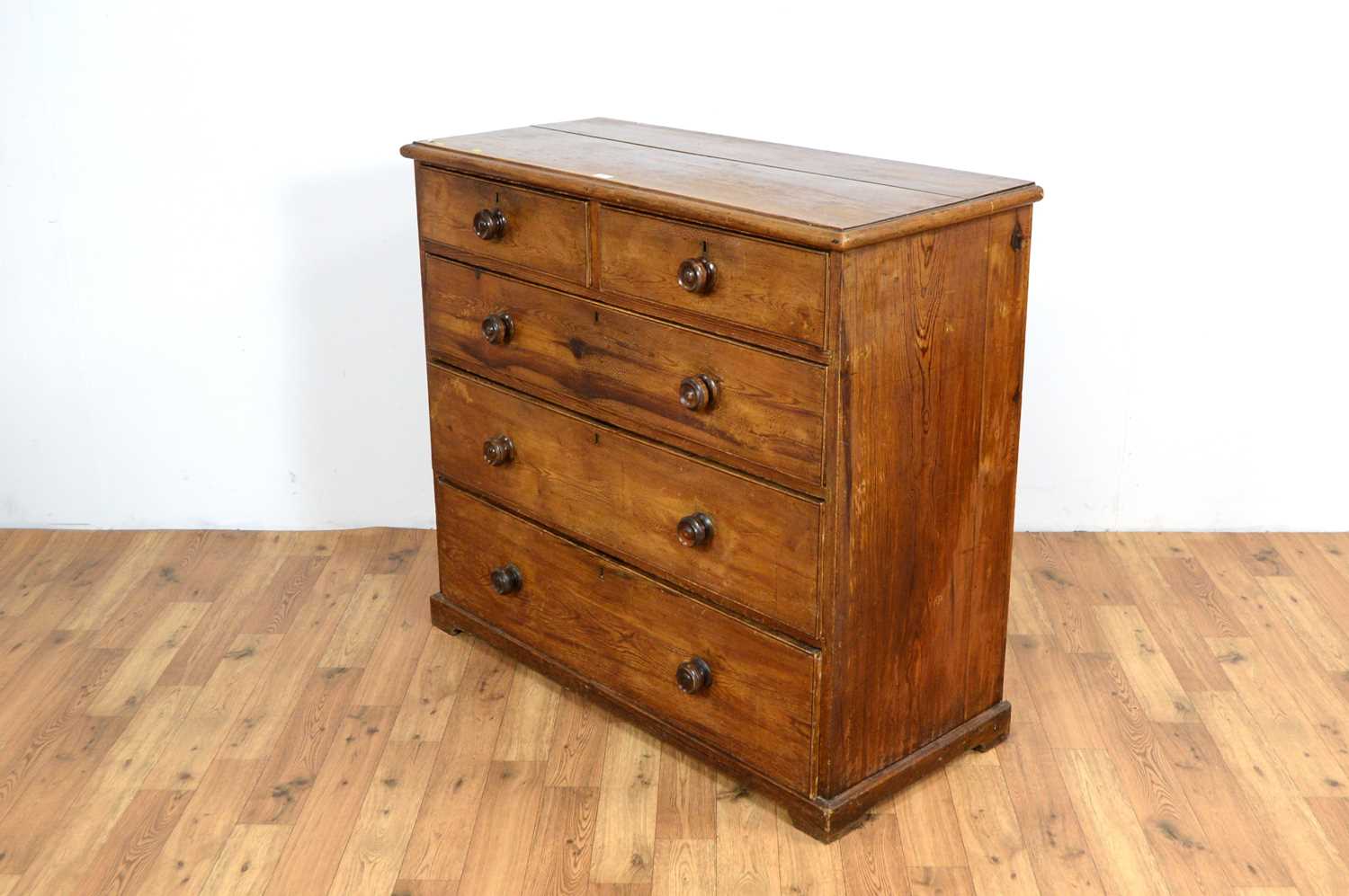 A 20th Century pine chest of drawers, with two short and three long drawers