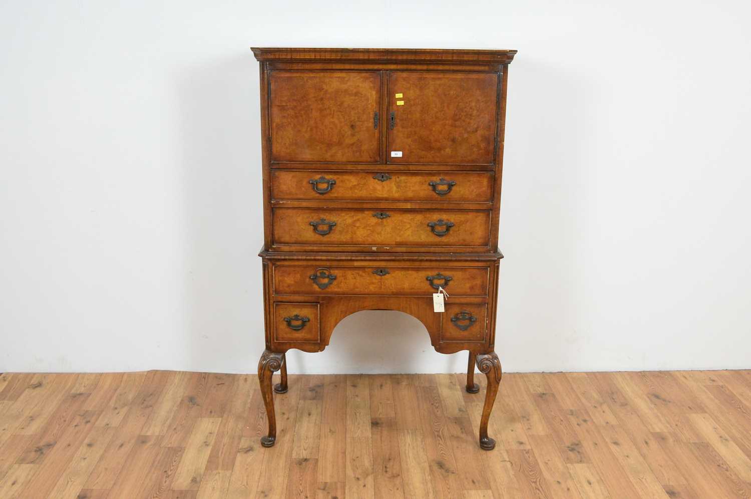 A Queen Anne style walnut and burr-walnut tallboy