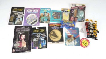 A collection of Star Trek collectible figures and memorabilia