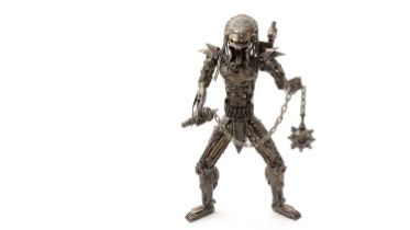 An original metal sculpture depicting the Predator