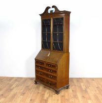 An Edwardian inlaid mahogany bureau bookcase