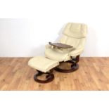 Stressless Ekornes; A retro reclining swivel easychair with matching footstool