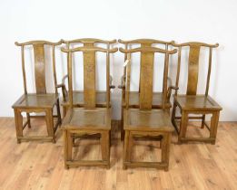 A 20th Century Chinese elm extending dining table and chairs
