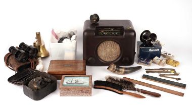 A Bush Bakelite radio, a Primus Pocket stove, and a selection of collector’s items