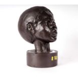 An African bronzed bust of a child