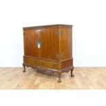A Chinese Chippendale style hardwood two door cabinet