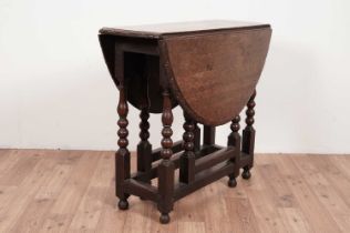 An 18th Century oak drop leaf table