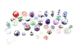 A selection of decorative glass paperweights of various sizes