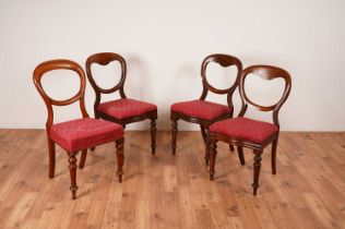 A set of four Victorian style mahogany balloon back dining chairs