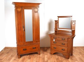 An Arts and Crafts early 20th Century oak bedroom suite