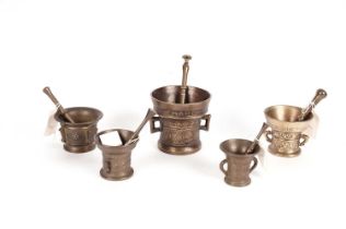 Assorted brass pestles and mortars