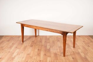 A rustic French fruitwood refectory dining table