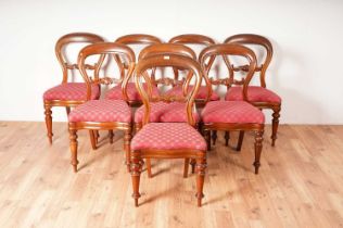 A set of eight Victorian mahogany balloon-back dining chairs