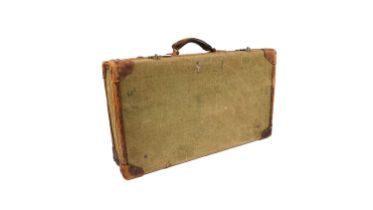 A 1940s leather bound canvas travel trunk