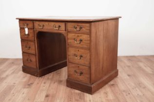 A reproduction mahogany desk