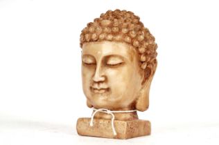 A stone bust of Buddha