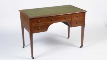 A late Victorian mahogany and line inlaid kneehole writing desk