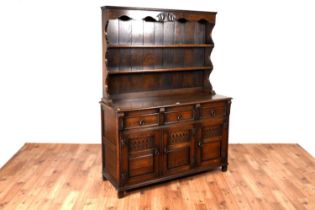 Style of 'Old Charm': A 18th Century style carved oak dresser