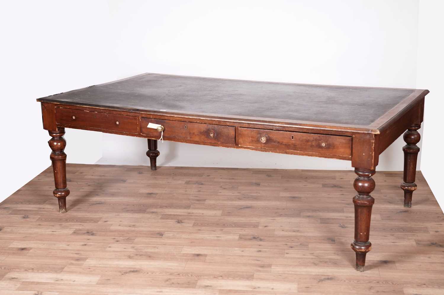 A substantial Victorian stained oak library table.