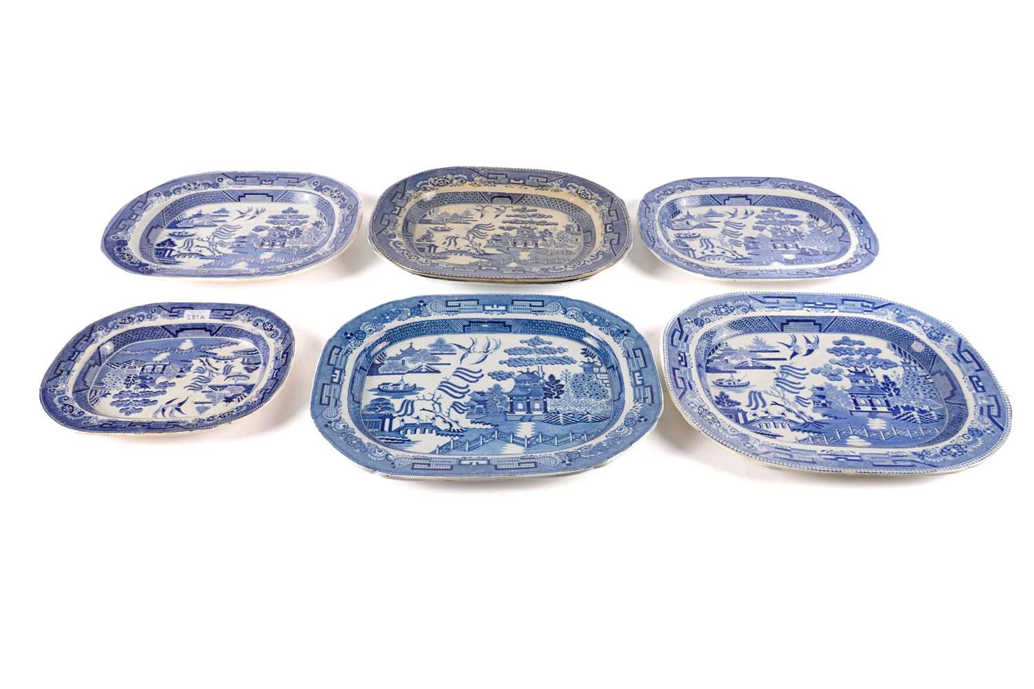 A collection of blue and white meat plates