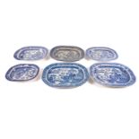 A collection of blue and white meat plates