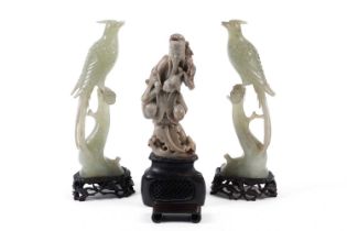 A Chinese carved soapstone figure group and two carved bowenite figures