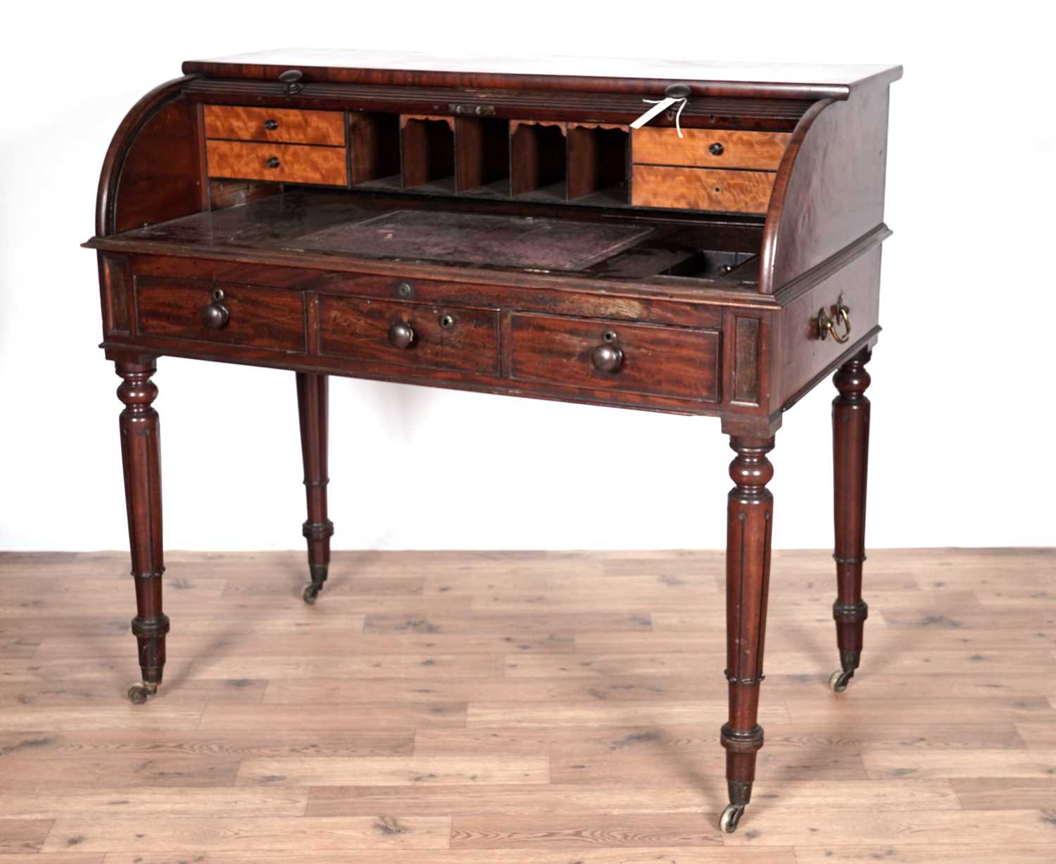 A George IV mahogany roll top desk