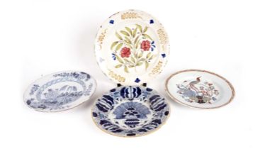 Four tin-glazed plates