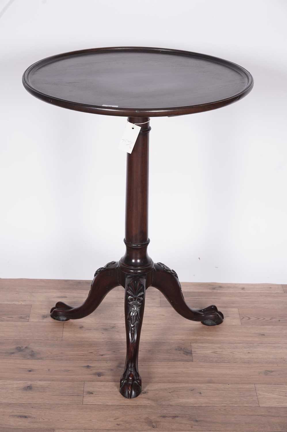 A decorative and well carved mahogany tripod table, c1900