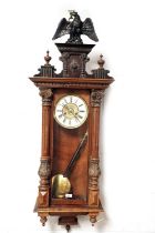 A late 19th Century walnut Vienna wall clock
