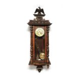 A late 19th Century beech and walnut Vienna wall clock