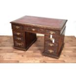A Victorian carved oak desk