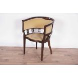 An attractive Edwardian inlaid mahogany tub chair