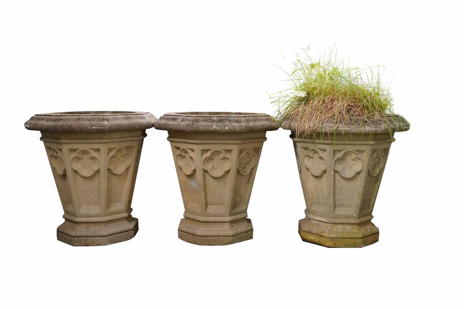 A decorative trio of octagonal stone composite planters