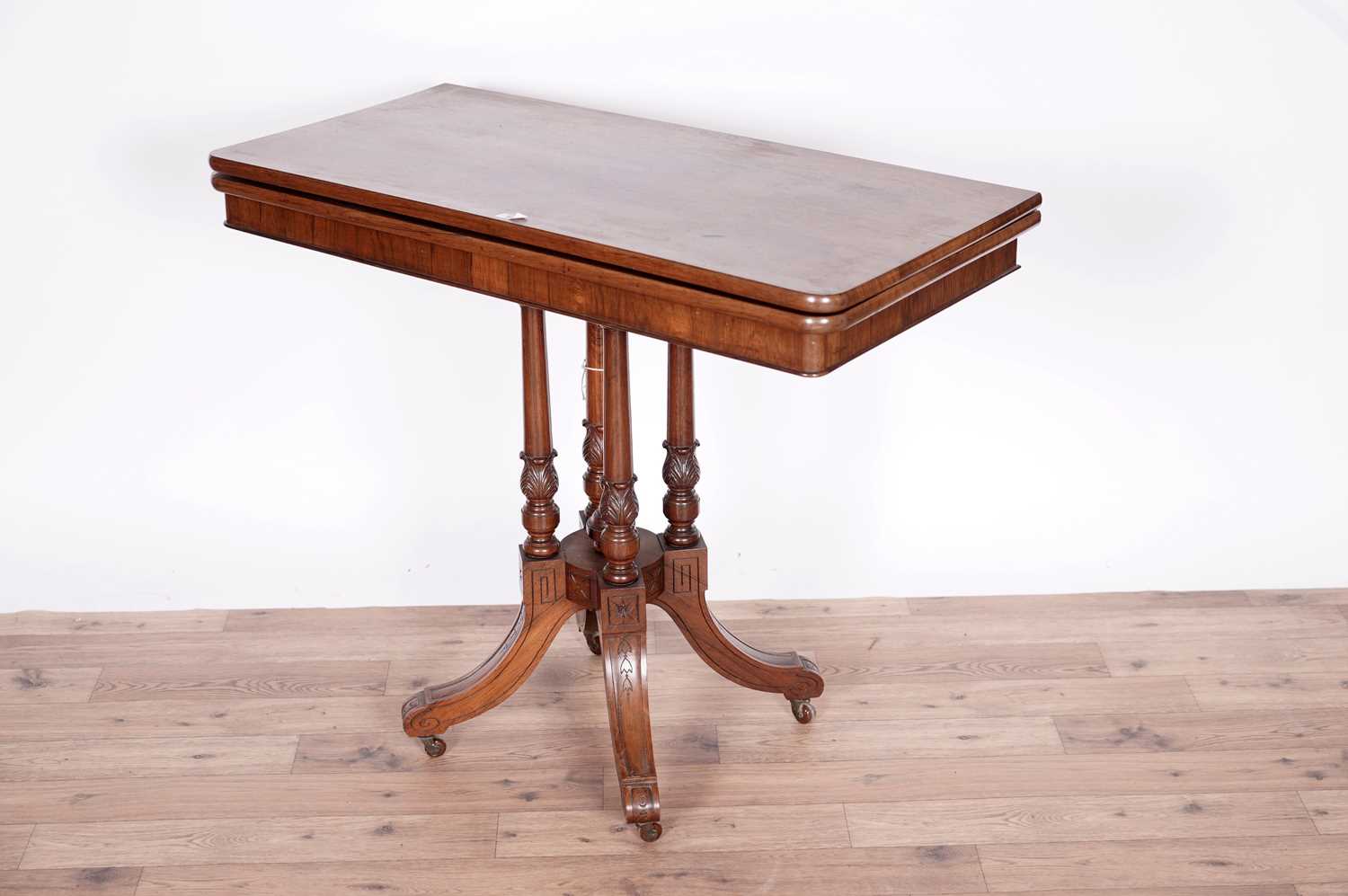 A Victorian rosewood card table