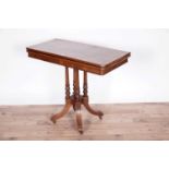 A Victorian rosewood card table