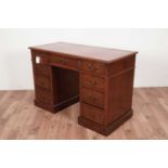 An early 20th Century walnut pedestal desk