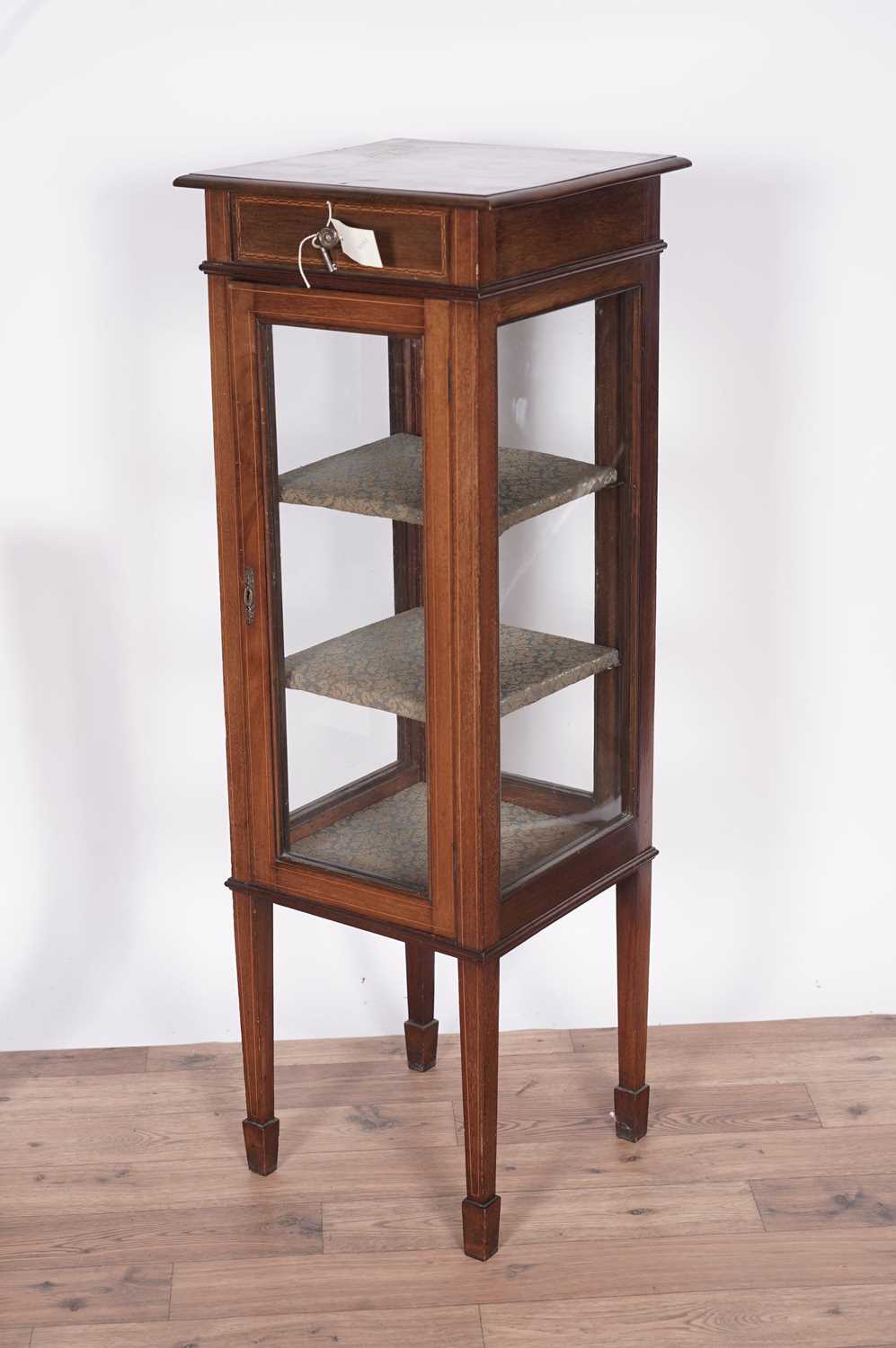 An Edwardian inlaid mahogany four-glass display cabinet