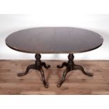 A George III mahogany pedestal dining table