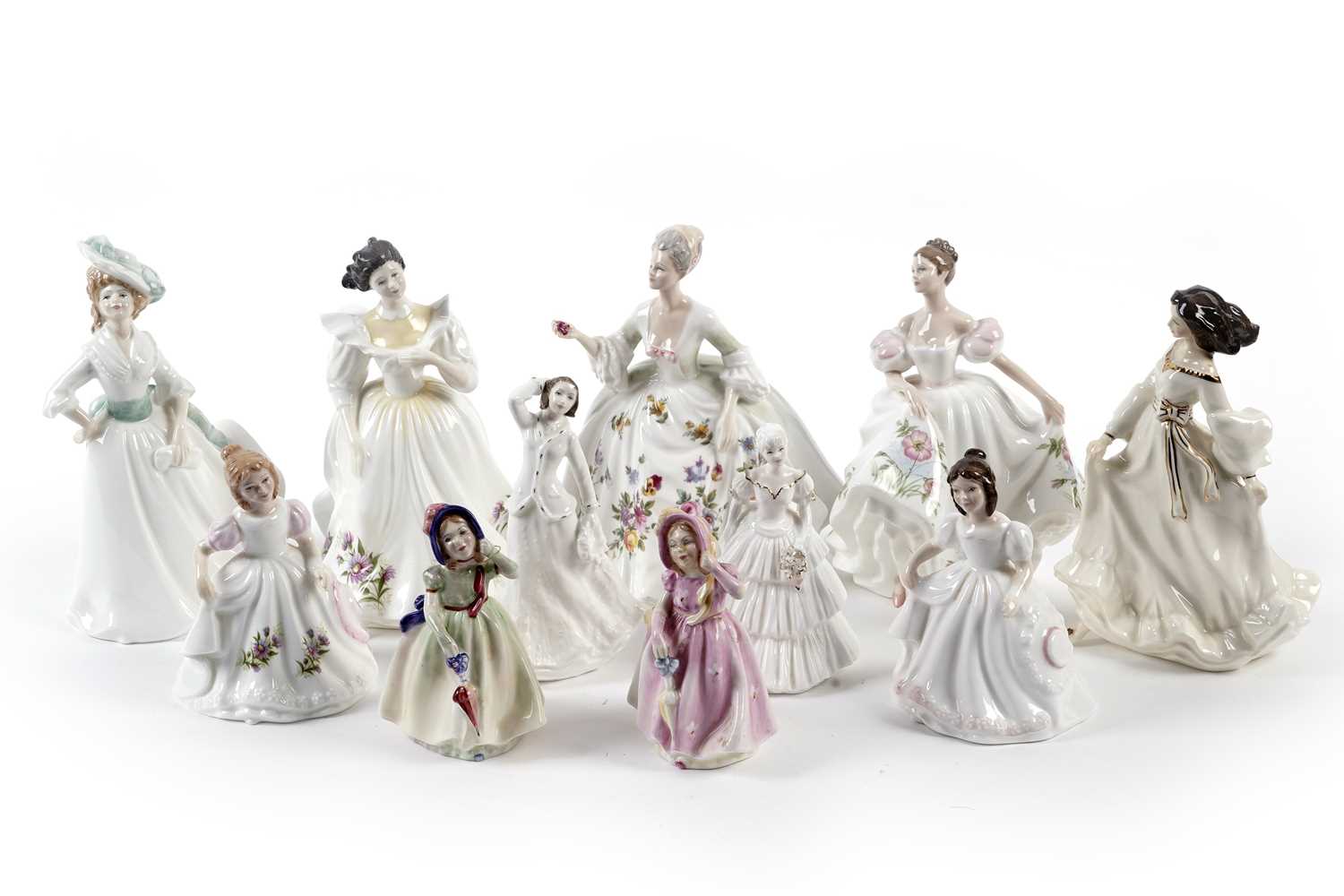 A collection of Royal Doulton ceramic figures of ladies