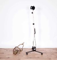 A brass hanging lamp and a Daray surgical spotlight