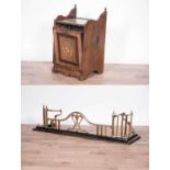 An Arts & Crafts brass and cast-iron fire fender; and an Edwardian inlaid walnut coal scuttle