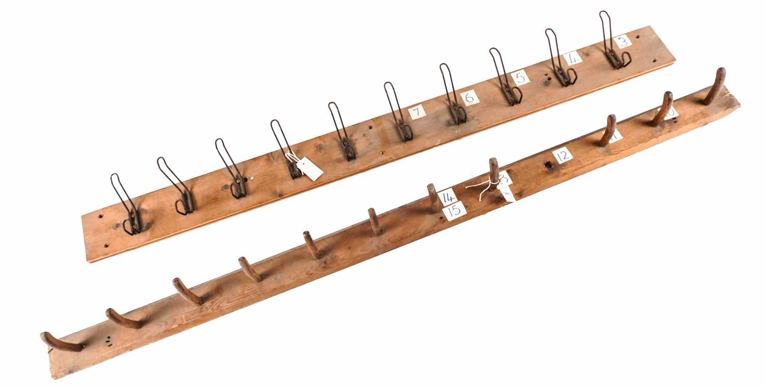 Two vintage wooden coat racks